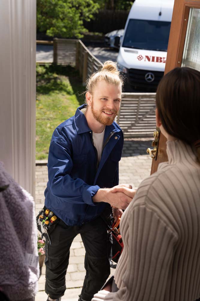 A staff member shaking a customers hand