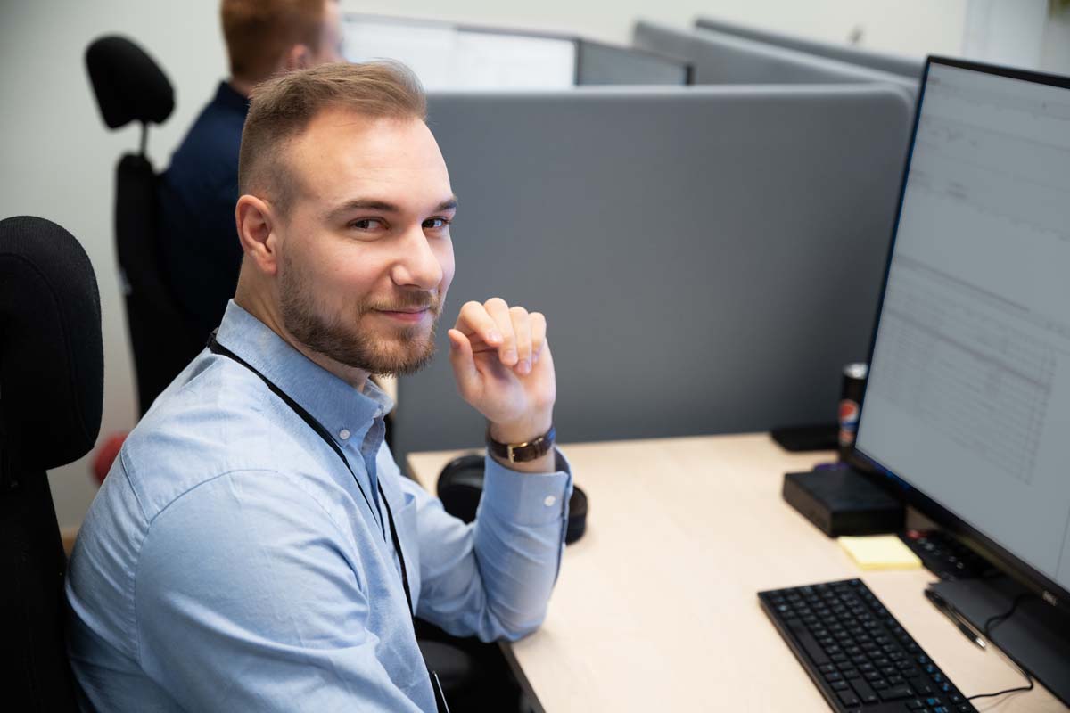 Colleagues looking at a computer
