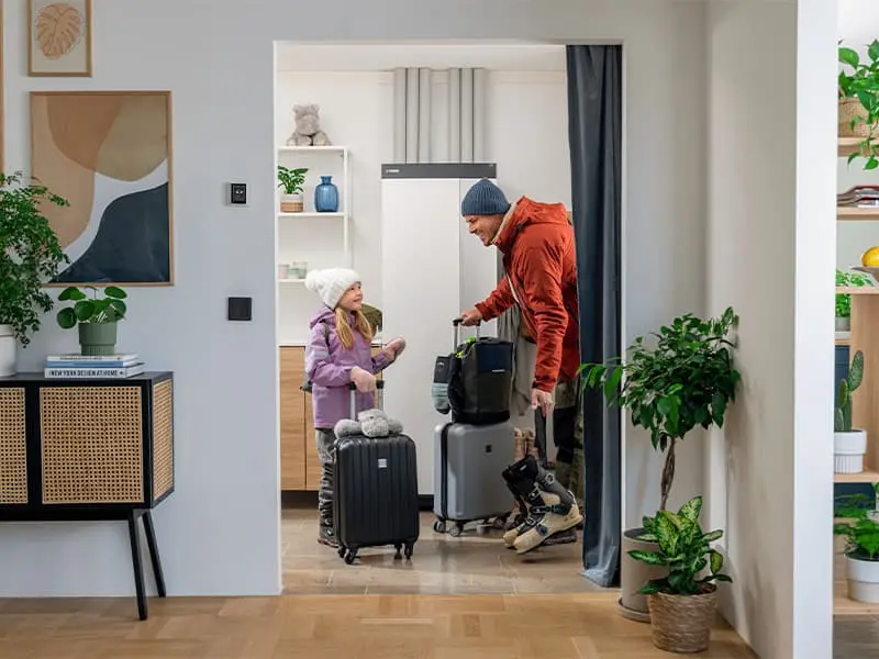 family in hall by heat pump